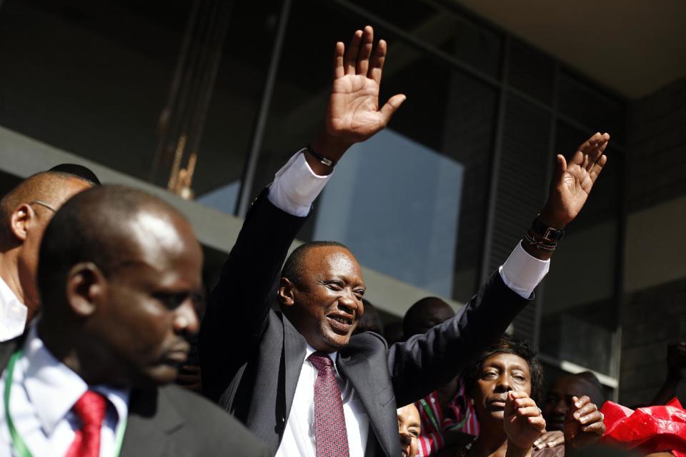 FILE - In this Saturday March 9, 2013 file photo, Kenyan president elect Uhuru Kenyatta waves at supporters after winning the election in Nairobi, Kenya. Prosecutors at the International Criminal Court have asked judges not to reject their faltering case against Kenyan President Uhuru Kenyatta entirely, despite acknowledging they do not have enough evidence to convict him. Defense lawyers have demanded acquittal. Presiding Judge Kuniko Ozaki said the panel hearing the case in The Hague, Netherlands, will not decide the matter Wednesday Feb. 5, 2014. (AP Photo/Jerome Delay, File)