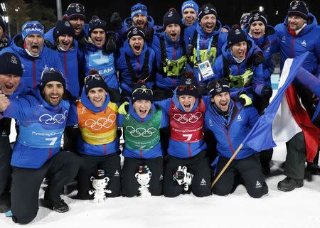 Biathlon - Pyeongchang 2018 Winter Olympics - Mixed Relay Final - Alpensia Biathlon Centre - Pyeongchang, South Korea - February 20, 2018 - Gold medalists: Martin Fourcade, Simon Desthieux, Marie Dorin Habert and Anais Bescond of France celebrate with team mates. REUTERS/Murad Sezer