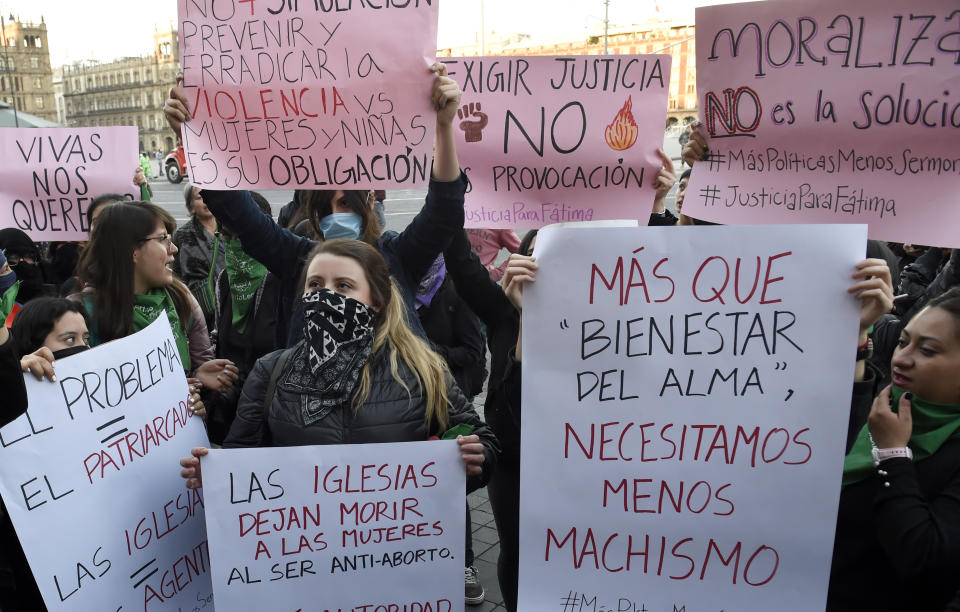 Demonstrators gather outside the National Palace, in Mexico City, on February 18, 2020, to protest gender violence. - Dozens of women protested Tuesday over the murder of a seven-year-old girl in the Mexican capital, a case that generated anger and outrage in a country used to violence. The murder of the minor shocked the country two days after hundreds of women protested in several cities in Mexico over the femicide of Ingrid Escamilla, a 25-year-old woman who was killed by her partner north of the Mexican capital. (Photo by ALFREDO ESTRELLA / AFP) (Photo by ALFREDO ESTRELLA/AFP via Getty Images)