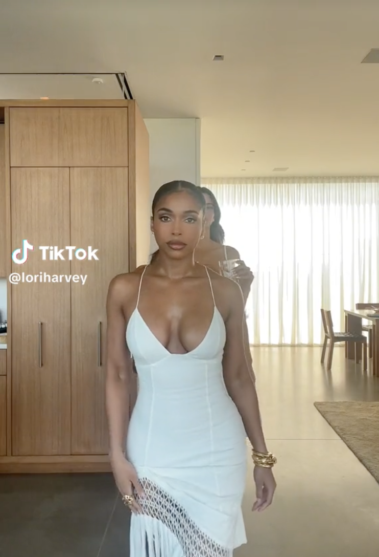 Lori Harvey wearing an all-white ensemble on her latest reel posted on July 3, on TikTok.