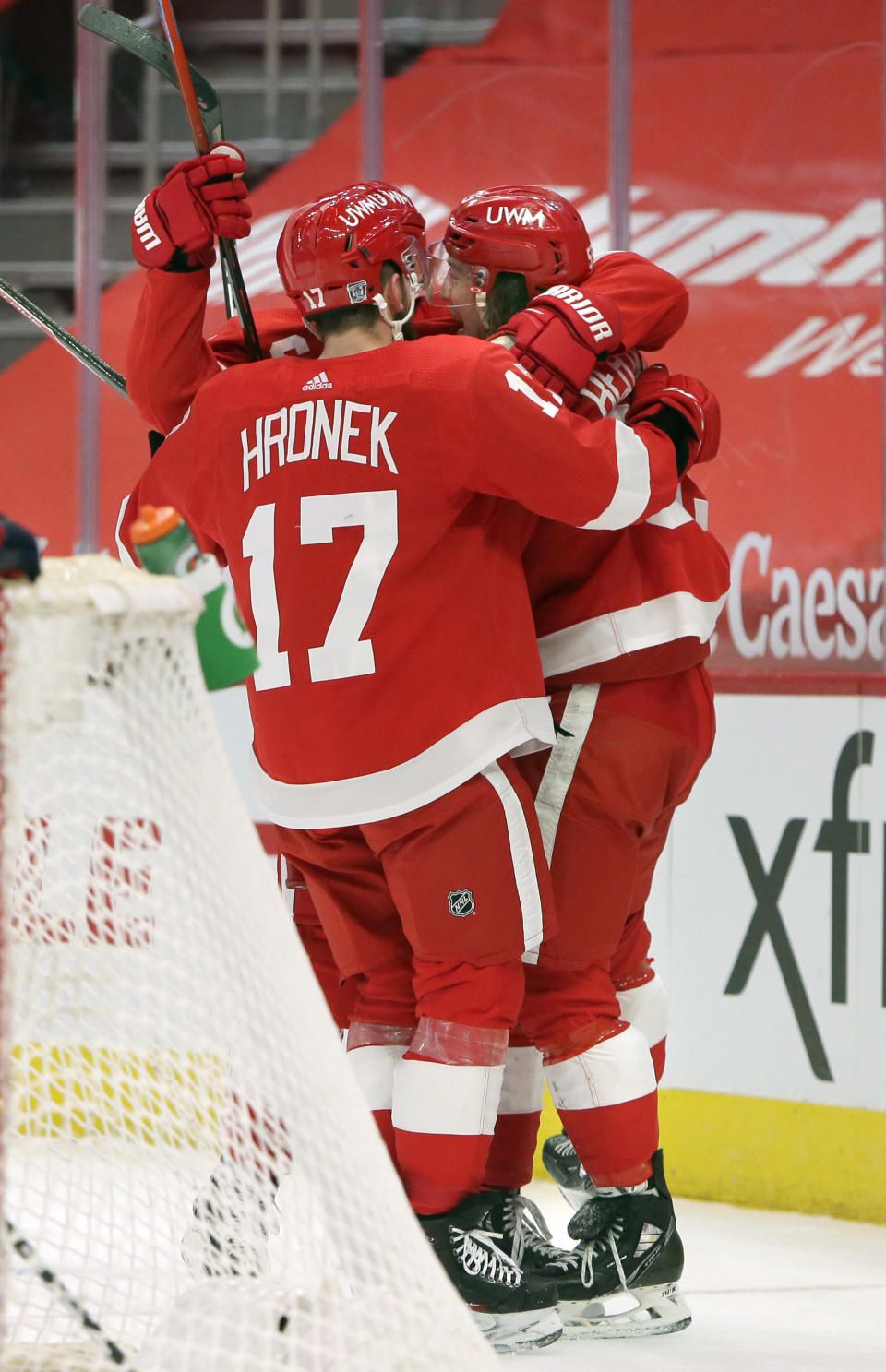Detroit Red Wings left wing Tyler Bertuzzi, right, celebrates with defenseman Filip Hronek (17) after scoring 15 seconds into overtime to defeat the Columbus Blue Jackets in an NHL hockey game Tuesday, Jan. 19, 2021, in Detroit. (AP Photo/Duane Burleson)