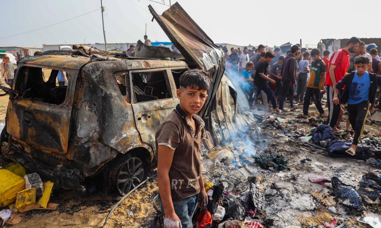 <span>Mike Godridge was transfixed by the look in this boy’s eyes and says ‘the UK should immediately cut off the supply of arms to this out-of-control regime in Israel’.</span><span>Photograph: Eyad Baba/AFP/Getty</span>