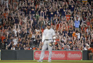 Fans do the wave during the third inning of a baseball game between the Houston Astros and the Chicago White Sox, Saturday, June 19, 2021, in Houston. (AP Photo/Eric Christian Smith)