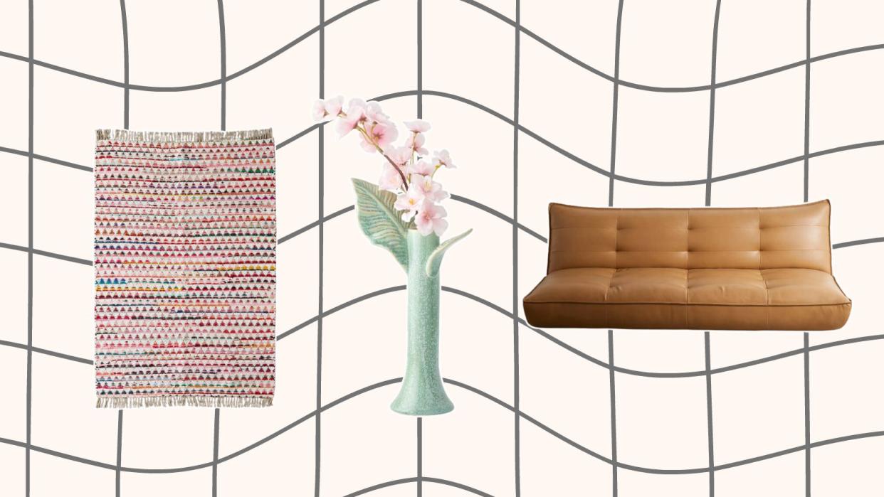  Urban Outfitters discounted home items including a multicolored area rug, a green leaf vase, and a brown leather sleeper sofa. 