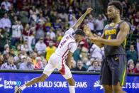 Arkansas guard Davonte Davis (4) celebrates after making a shot after being fouled as Baylor guard LJ Cryer (4) looks on during the first half of an NCAA college basketball game in Waco, Texas, Saturday, Jan. 28, 2023. (AP Photo/Gareth Patterson)