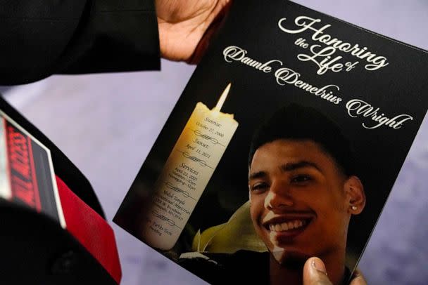 PHOTO: In this April 22, 2021, file photo, a mourner holds a program for the funeral services of Daunte Wright at Shiloh Temple International Ministries in Minneapolis. (John Minchillo/AP, FILE)