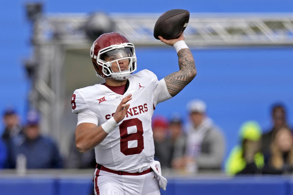 Oklahoma quarterback Dillon Gabriel passes during the first half of an NCAA college football game against Kansas Saturday, Oct. 28, 2023, in Lawrence, Kan. (AP Photo/Charlie Riedel)