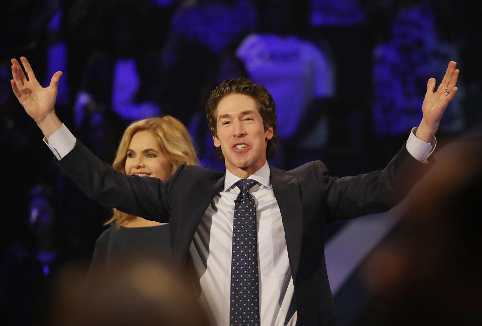 Joel Osteen, the pastor of Lakewood Church, stands with his wife, Victoria Osteen, as he conducts a service on Sept. 3. He was criticized for not initially opening his giant church as a shelter for Hurricane Harvey&nbsp;evacuees. (Photo: Joe Raedle via Getty Images)