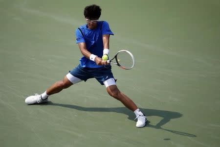 Sep 3, 2015; New York, NY, USA; Hyeon Chung of Korea hits a backhand against Stan Wawrinka of Swizterland (not pictured) on day four of the 2015 U.S. Open tennis tournament at USTA Billie Jean King National Tennis Center. Wawrinka won 7-6 (2), 7-6 (4), 7-6 (6). Mandatory Credit: Geoff Burke-USA TODAY Sports