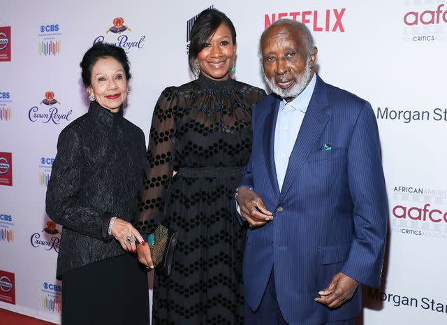 Mark Von Holden/Invision/AP/Shutterstock Nicole Avant (center) with her parents Jacqueline and Clarence, before the tragedy that took her mother's life.