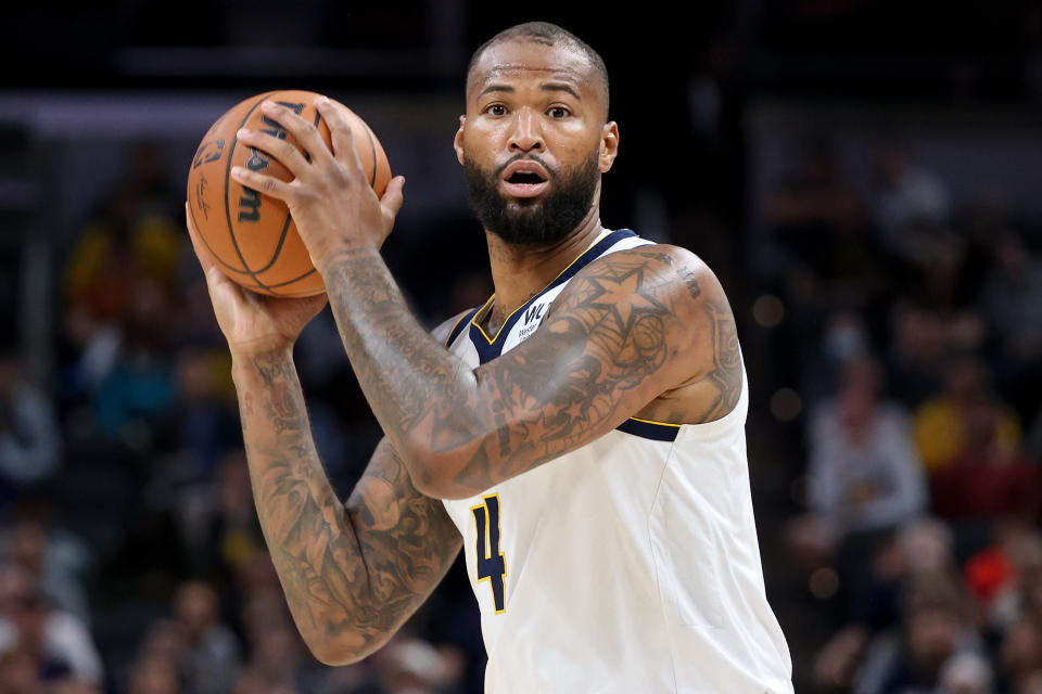 INDIANAPOLIS, INDIANA - MARCH 30: DeMarcus Cousins #4 of the Denver Nuggets handles the ball in the fourth quarter against the Indiana Pacers at Gainbridge Fieldhouse on March 30, 2022 in Indianapolis, Indiana. NOTE TO USER: User expressly acknowledges and agrees that, by downloading and or using this Photograph, user is consenting to the terms and conditions of the Getty Images License Agreement. (Photo by Dylan Buell/Getty Images)