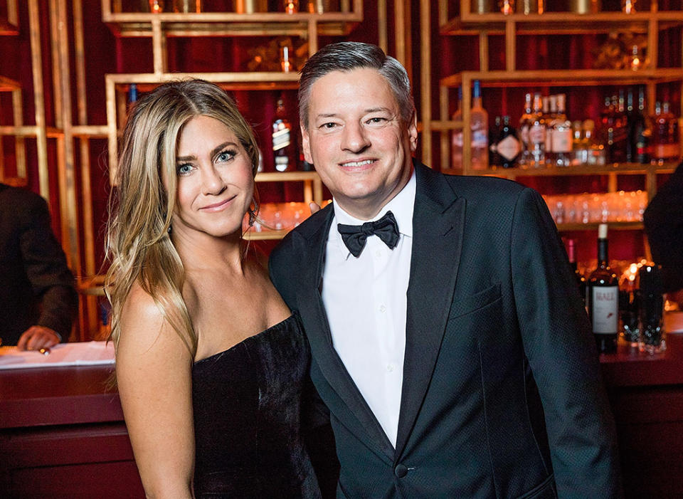 <p>Also at the Netflix soiree was Jennifer Aniston. No word yet on whether she crossed paths with Angelina Jolie, but the <em>Friends</em> star certainly had a powerful squad — she was photographed hanging out with Ted Sarandos, Netflix’s chief content officer. (Photo: Netflix via Getty Images) </p>