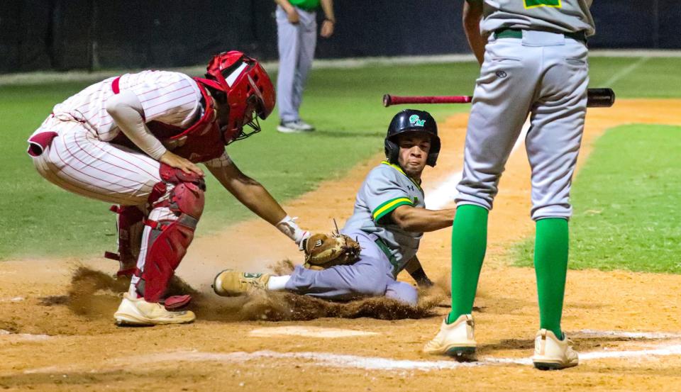 North's Logan Smith tags out the Fort Myers Runner after he tried to squeeze in at home on a bunt play that didn't happen. Regional baseball was played between Fort Myers and North Fort Myers. Fort Myers won 4-0. At North Fort Myers, Tuesday, May 10, 2022. 