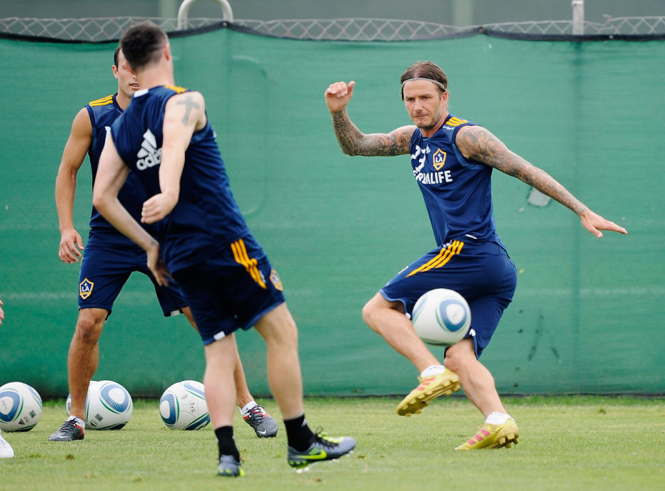 CARSON, CA - AUGUST 19: David Beckham #23 of the Los Angeles Galaxy attempts to block a pass by ewly acquired forward Robbie Keane #14 and during training at The Home Depot Center on August 19, 2011 in Carson, California. Keane, who is the captain of Ireland's national team, will make his MLS debut against the San Jose Earthquakes on Saturday at The Home Depot Center. (Photo by Kevork Djansezian/Getty Images)