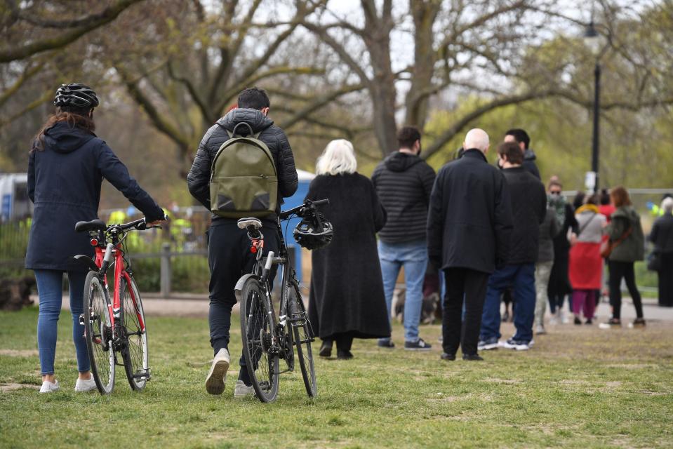 People stand in line for coronavirus surge testing on Clapham Common, south London (PA)