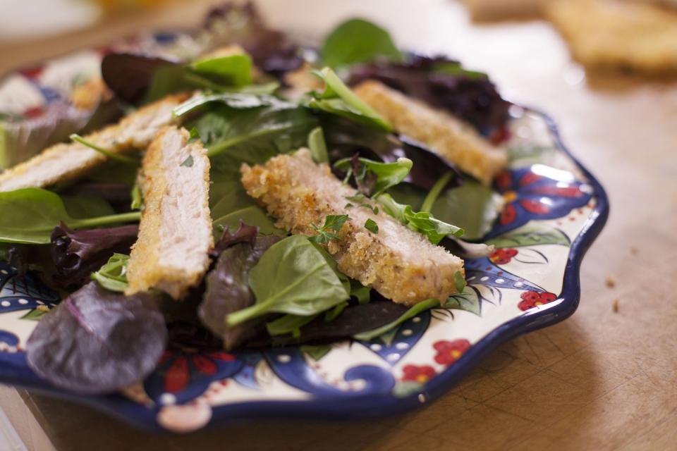 <p><a href="https://www.gettyimages.com/detail/news-photo/fresh-chicken-and-pork-cutlets-on-a-mixed-green-salad-on-news-photo/905749416" rel="nofollow noopener" target="_blank" data-ylk="slk:One former employee;elm:context_link;itc:0;sec:content-canvas" class="link ">One former employee </a>would "cringe" hearing customers order the Oriental Chicken Salad, as it contains roughly 1,500 calories. Just do yourself a favor and grab a burger instead. </p>