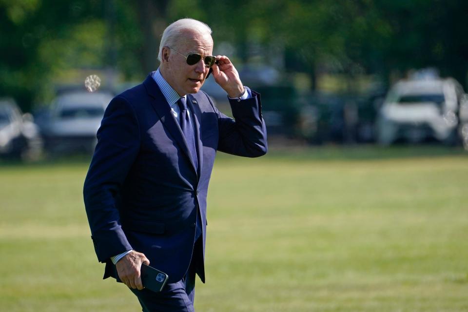 President Joe Biden walks off of Marine One on the Ellipse near the White House on Thursday after returning from a trip to Cleveland.