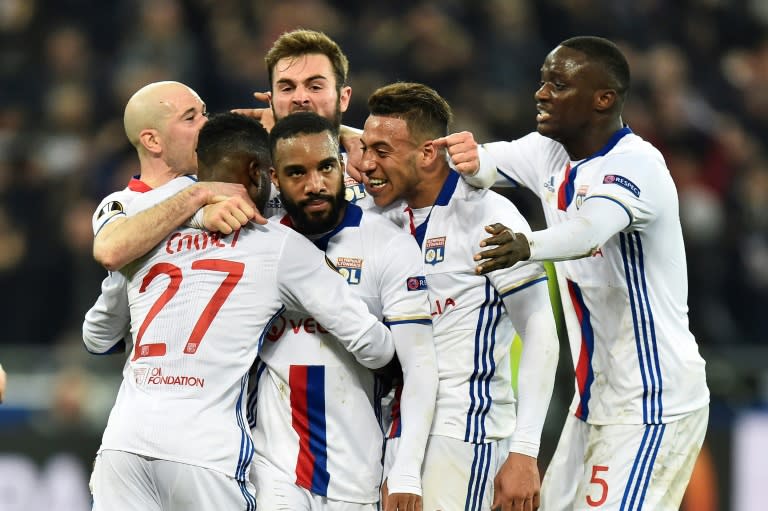 Lyon's French forward Alexandre Lacazette (C) celebrates with teammates after scoring a goal against AS Roma during their UEFA Europa League round of 16 football match on March 9, 2017