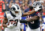 <p>Los Angeles Rams running back Todd Gurley pushes away Houston Texans outside linebacker Jadeveon Clowney during the first half of an NFL football game, Sunday, Nov. 12, 2017, in Los Angeles. (AP Photo/Alex Gallardo) </p>