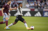 San Jose Earthquakes forward Jeremy Ebobisse, right, pursues the ball next to Colorado Rapids defender Danny Wilson during the first half of an MLS soccer match Saturday, June 3, 2023, in Commerce City, Colo. (AP Photo/David Zalubowski)