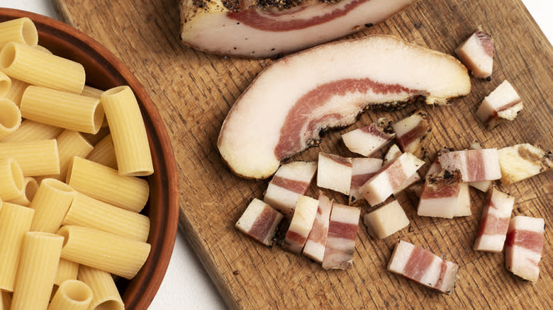 Guanciale on wood cutting board