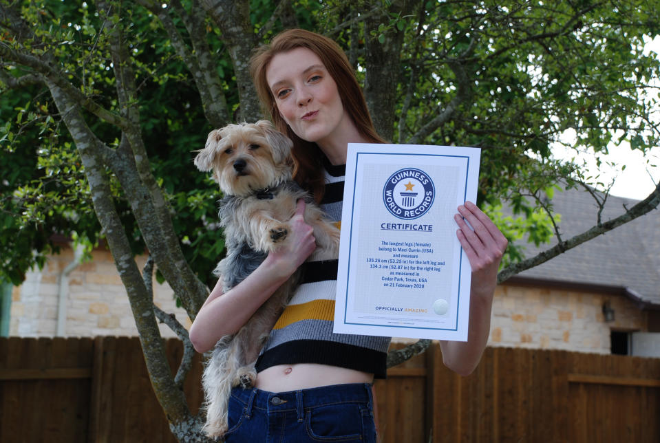 Currin holds her certificate from Guinness World Records. (Courtesy Currin family)
