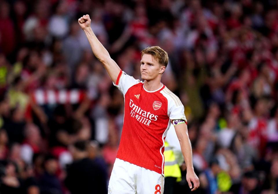 Martin Odegaard celebrated Arsenal’s victory at the final whistle (PA)