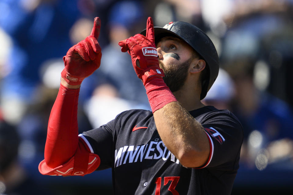 The Minnesota Twins' Joey Gallo celebrates after hitting a three-run home run during the seventh inning of a baseball game against the Kansas City Royals, Sunday, April 2, 2023, in Kansas City, Mo. (AP Photo/Reed Hoffmann)