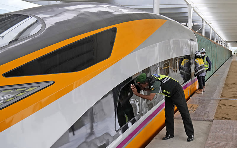 A soldier peeks into a newly unveiled Comprehensive Inspection Train unit