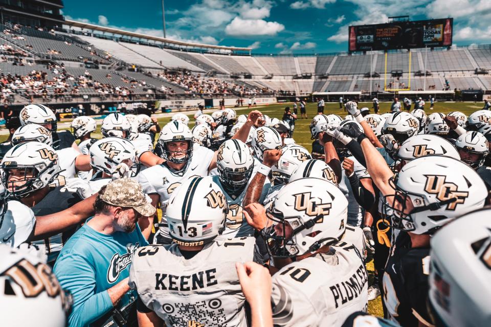 UCF's Gold team prepares to take the field ahead of its spring game, Saturday, April 16, 2022.