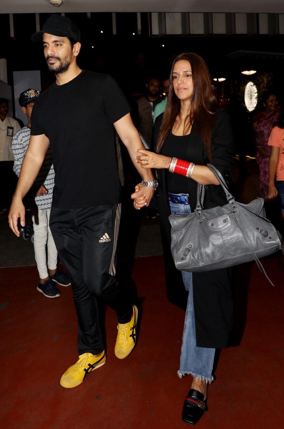 Neha Dhupia and Angad Bedi arrive in Mumbai.