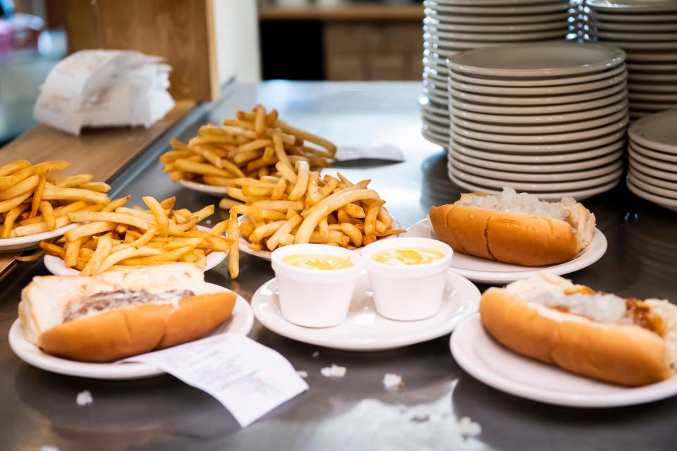 Plates of hot food wait to be served to patrons at the Famous Hot Weiner on Dart Drive in Hanover on Wednesday, July 14, 2021.