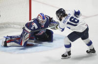 United States goaltender Aerin Frankel (31) makes a save against Finland's Petra Nieminen (16) during the second period in the semifinals of the IIHF women's world hockey championships Saturday, April 13, 2024, in Utica, N.Y. (Christinne Muschi/The Canadian Press via AP)