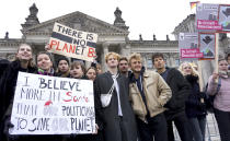 Students protest under the banner of 'Fridays for Future' in front of the Reichstag building, host of the German Federal Parliament, in Berlin, Germany, Friday, Dec. 14, 2018 against the climate change. (AP Photo/Michael Sohn)