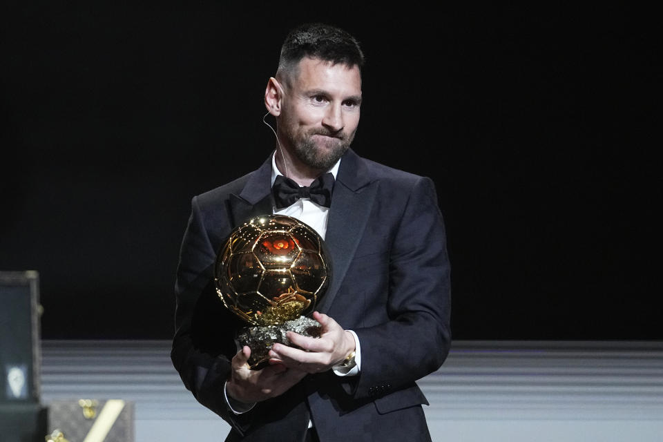 Inter Miami's and Argentina's national team player Lionel Messi receives the 2023 Ballon d'Or trophy during the 67th Ballon d'Or (Golden Ball) award ceremony at Theatre du Chatelet in Paris, France, Monday, Oct. 30, 2023. (AP Photo/Michel Euler)