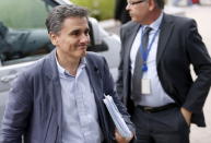 Newly appointed Greek Finance Minister Euclid Tsakalotos arrives at a euro zone finance ministers meeting on the situation in Greece in Brussels, July 7, 2015. REUTERS/Francois Lenoir