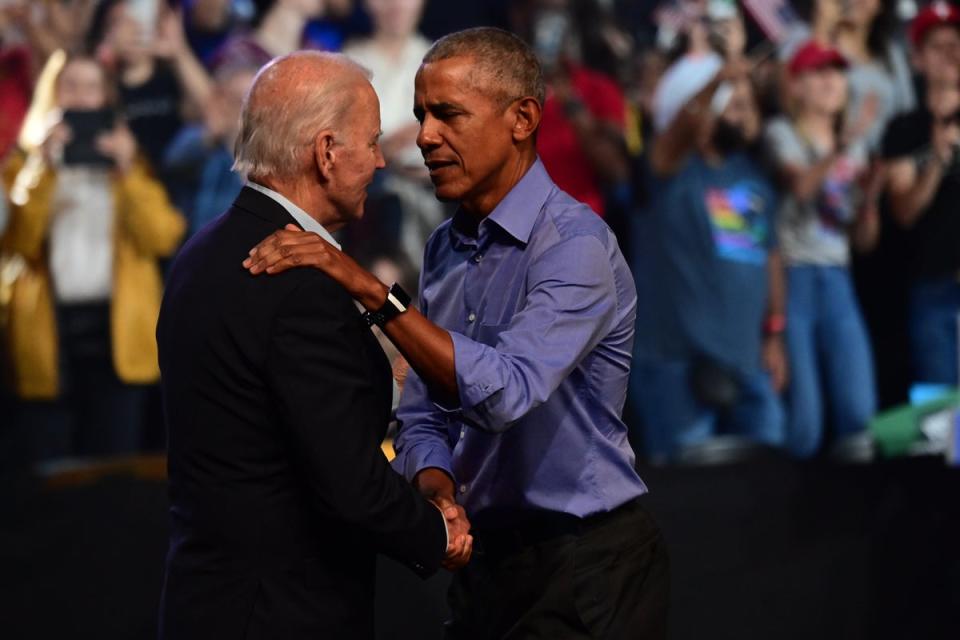President Joe Biden and former President Barack Obama embrace on stage during a rally at the Liacouras Center on November 5, 2022, in Philadelphia, Pennsylvania. Obama reportedly didn’t object to George Clooney’s recent op-ed telling Biden to step aside (Getty Images)