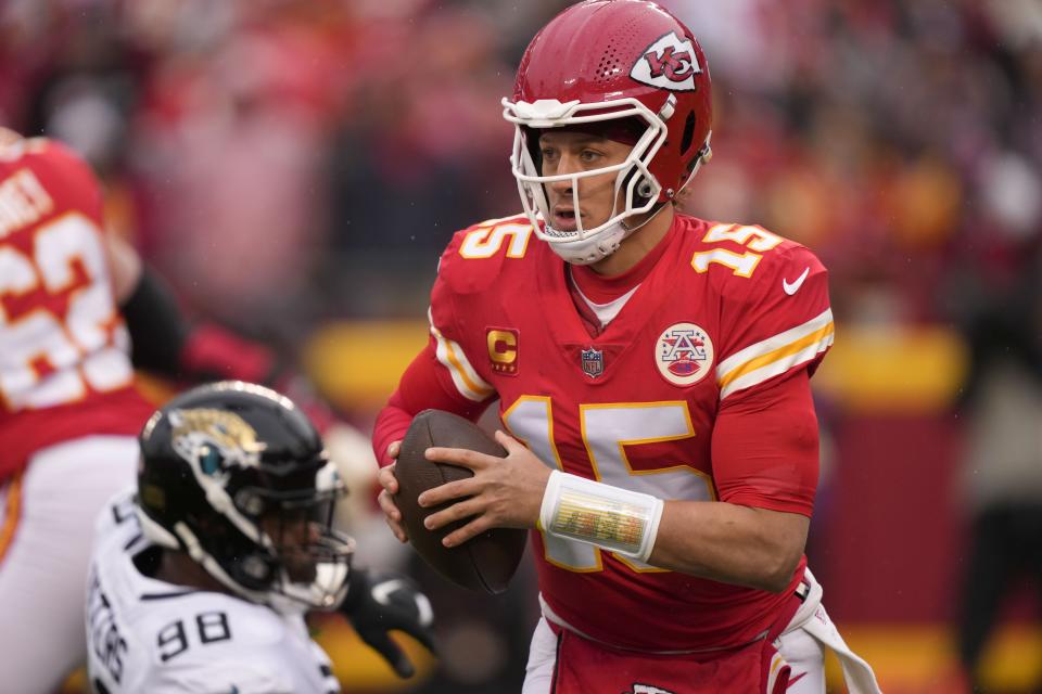 Kansas City Chiefs quarterback Patrick Mahomes (15) runs in the pocket against the Jacksonville Jaguars during the first half of an NFL divisional round playoff football game, Saturday, Jan. 21, 2023, in Kansas City, Mo. (AP Photo/Charlie Riedel)