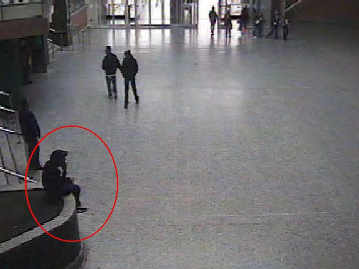 A CCTV still shows suicide bomber Salman Abedi sitting in the foyer of the Manchester Arena during a reconnaisance visit on 21 May 2017 (Manchester Arena Inquiry )