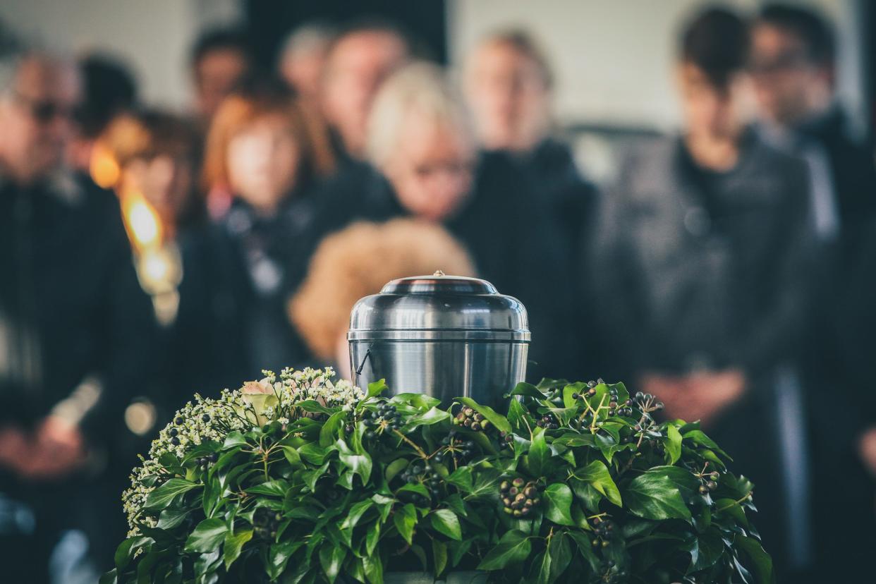 A metal urn with ashes at a memorial service.