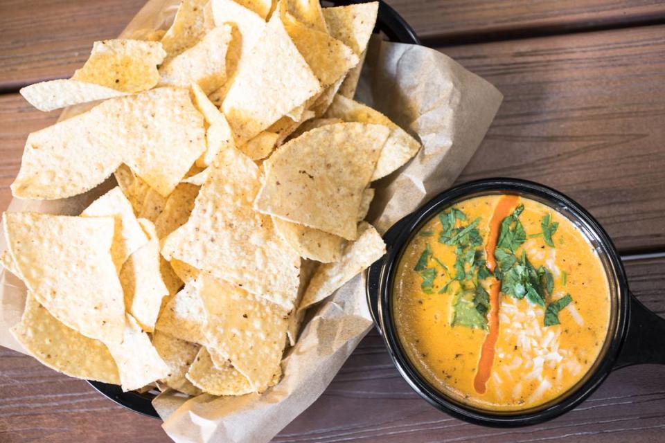 Texas transplants sing the praises of green chile queso from Austin-based Torchy’s Tacos, which is opening its first North Carolina location in Raleigh.