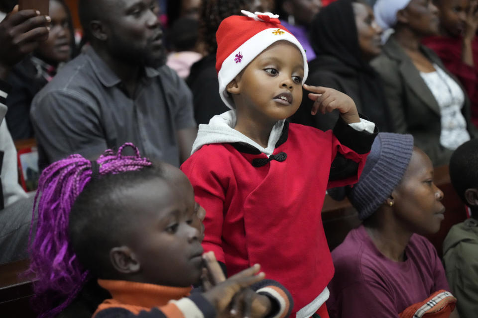 A child attends Mass at Our Lady of Mercy Catholic Church in Nairobi, Kenya, Sunday, Dec. 24, 2023. (AP Photo/Sayyid Abdul Azim)