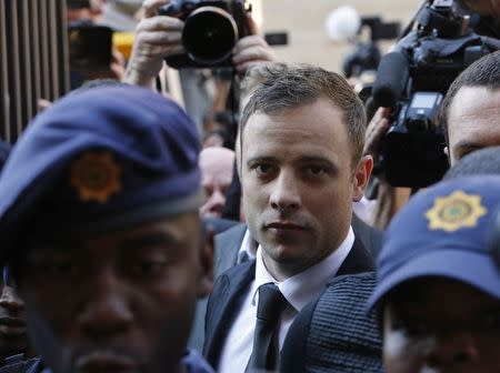 South African Olympic and Paralympic sprinter Oscar Pistorius arrives at the North Gauteng High Court in Pretoria September 12, 2014. REUTERS/Mike Hutchings