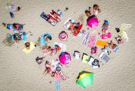 <p>Beach goers in Scheveningen, the Netherlands, Aug. 7, 2018. Media reports state that Europe is currently in the middle of a heatwave with European temperature records possibly broken in the coming days. (Photo: Jerry Lampen/EPA-EFE/REX/Shutterstock) </p>