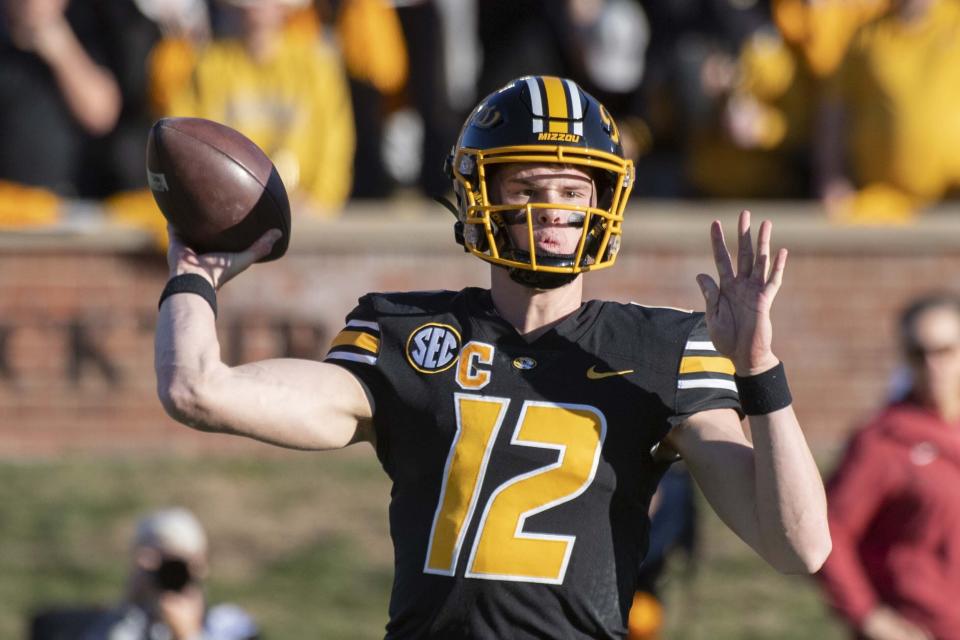 Missouri quarterback Brady Cook throws a pass during the first quarter of an NCAA college football game against Arkansas, Friday, Nov. 25, 2022, in Columbia, Mo. (AP Photo/L.G. Patterson)