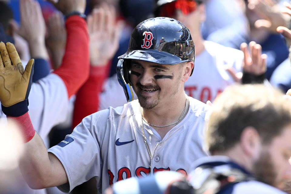 Boston Red Sox's Reese McGuire reacts in the dugout after hitting a three-run home run against the Los Angeles Angels during the sixth inning of a baseball game in Anaheim, Calif., Sunday, April 7, 2024. (AP Photo/Alex Gallardo)
