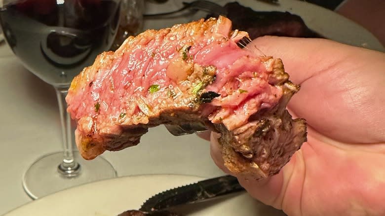 a juicy piece of steak on a fork