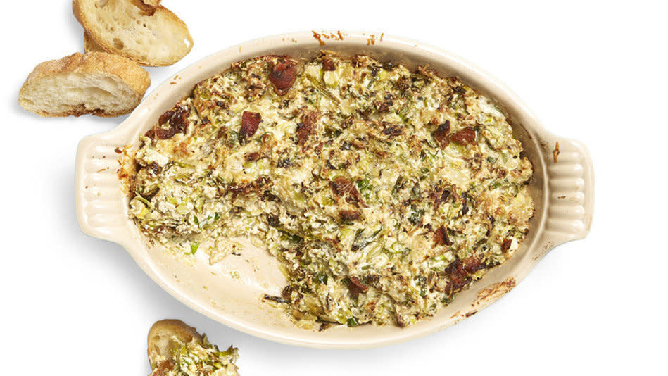 We adore these mini cabbages as a side dish, but it turns out they can also be key players in a zesty, cheesy dip. This one includes bacon (which is basically all we needed to hear), garlic, ricotta, Parmesan, lemon zest and sliced Brussels sprouts. You bake the dip until it's browned on top and serve hot with toasted baguette slices, chips or crackers. <br /><br /> <strong>Get the recipe: <a href="http://www.oprah.com/food/Warm-Charred-Brussels-Sprouts-Dip-With-Ricotta-and-Bacon-Recipe" target="_blank">Warm Charred Brussels Sprouts Dip with Ricotta and Bacon</a></strong>