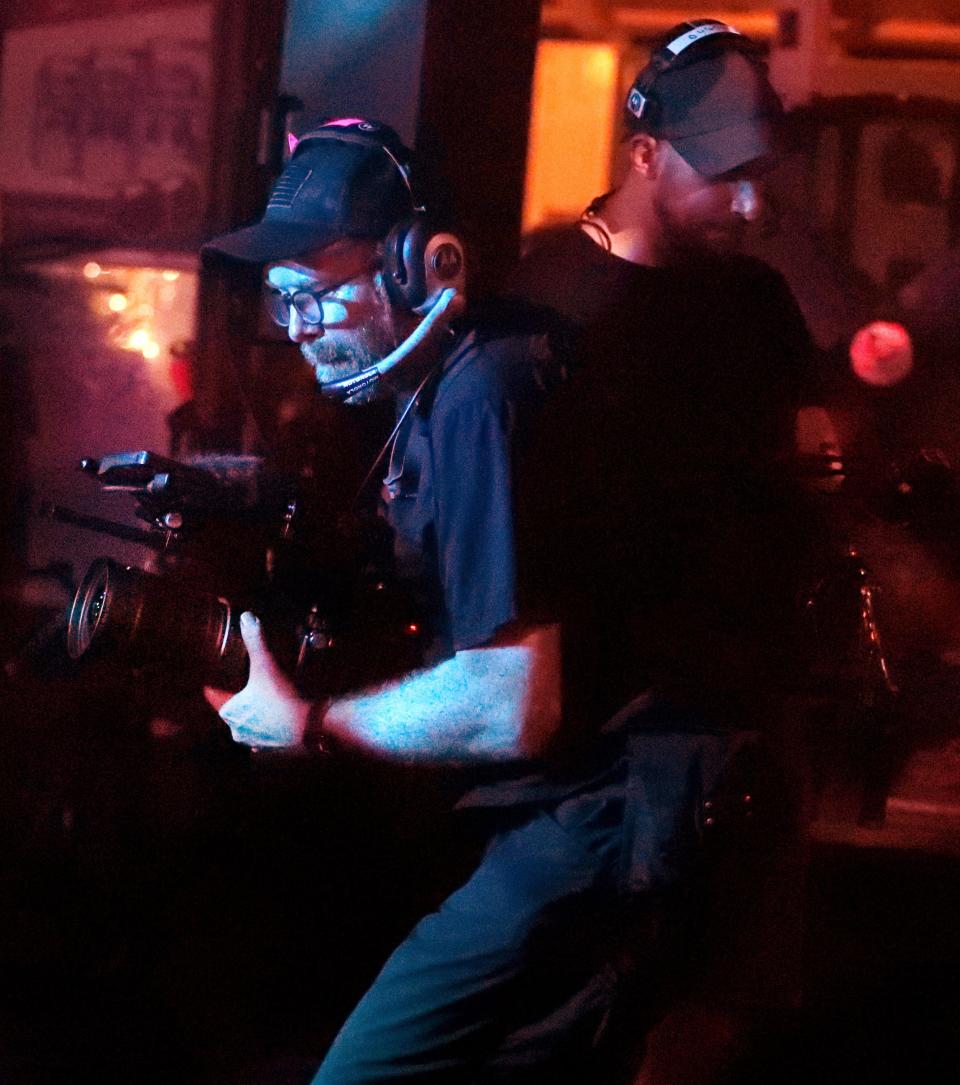 A film crew for the HBO documentary series "We're" Here" records the crowd and several drag performances during the Open Stage Drag Night on Saturday, Aug. 5, 2023, at the Boro Bar and Grill.