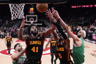 Atlanta Hawks forward Saddiq Bey (41) works for the rebound against the Boston Celtics during the second half of Game 3 of a first-round NBA basketball playoff series, Friday, April 21, 2023, in Atlanta. (AP Photo/Brynn Anderson)